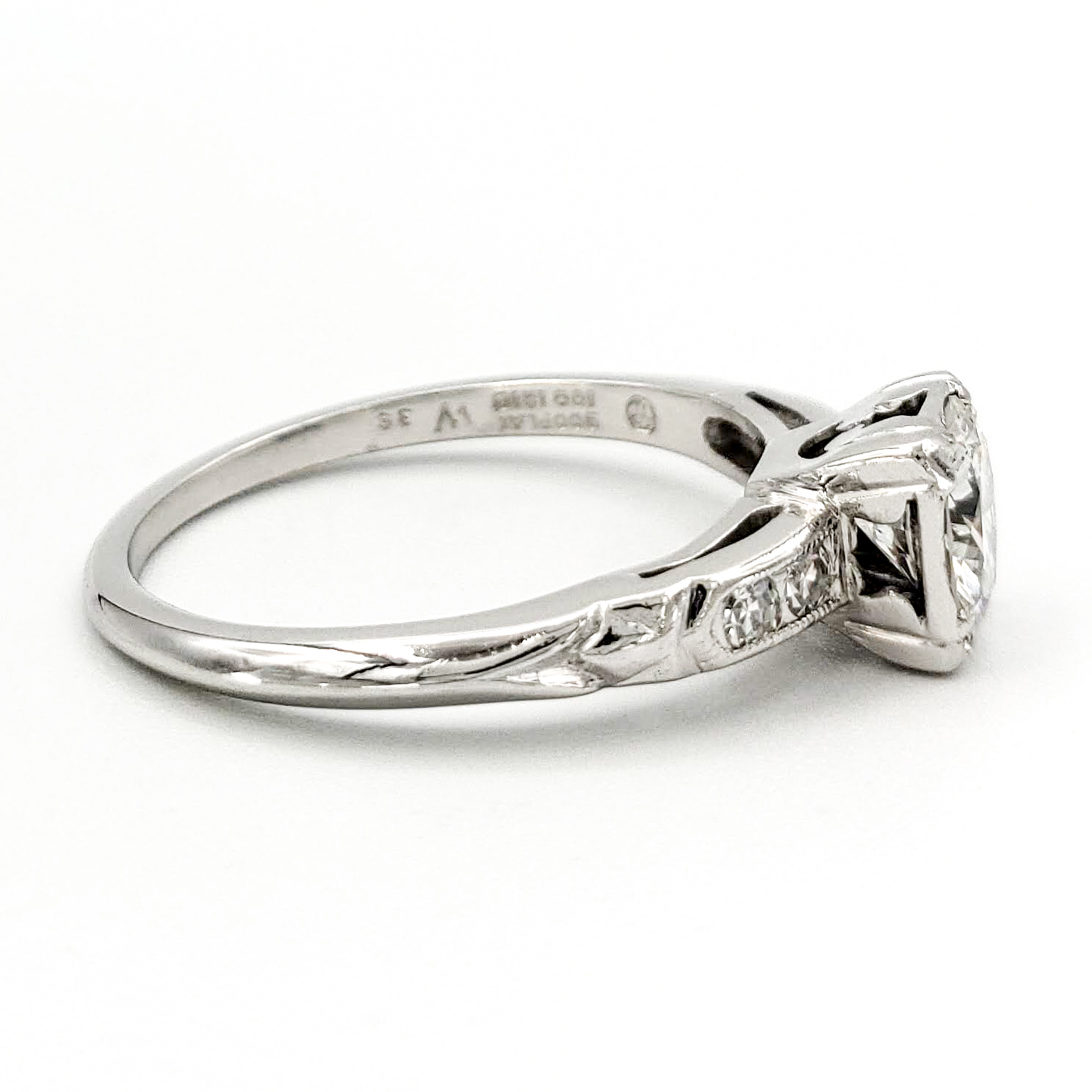 vintage-platinum-engagement-ring-with-0-64-carat-round-brilliant-cut-diamond-egl-e-vs2