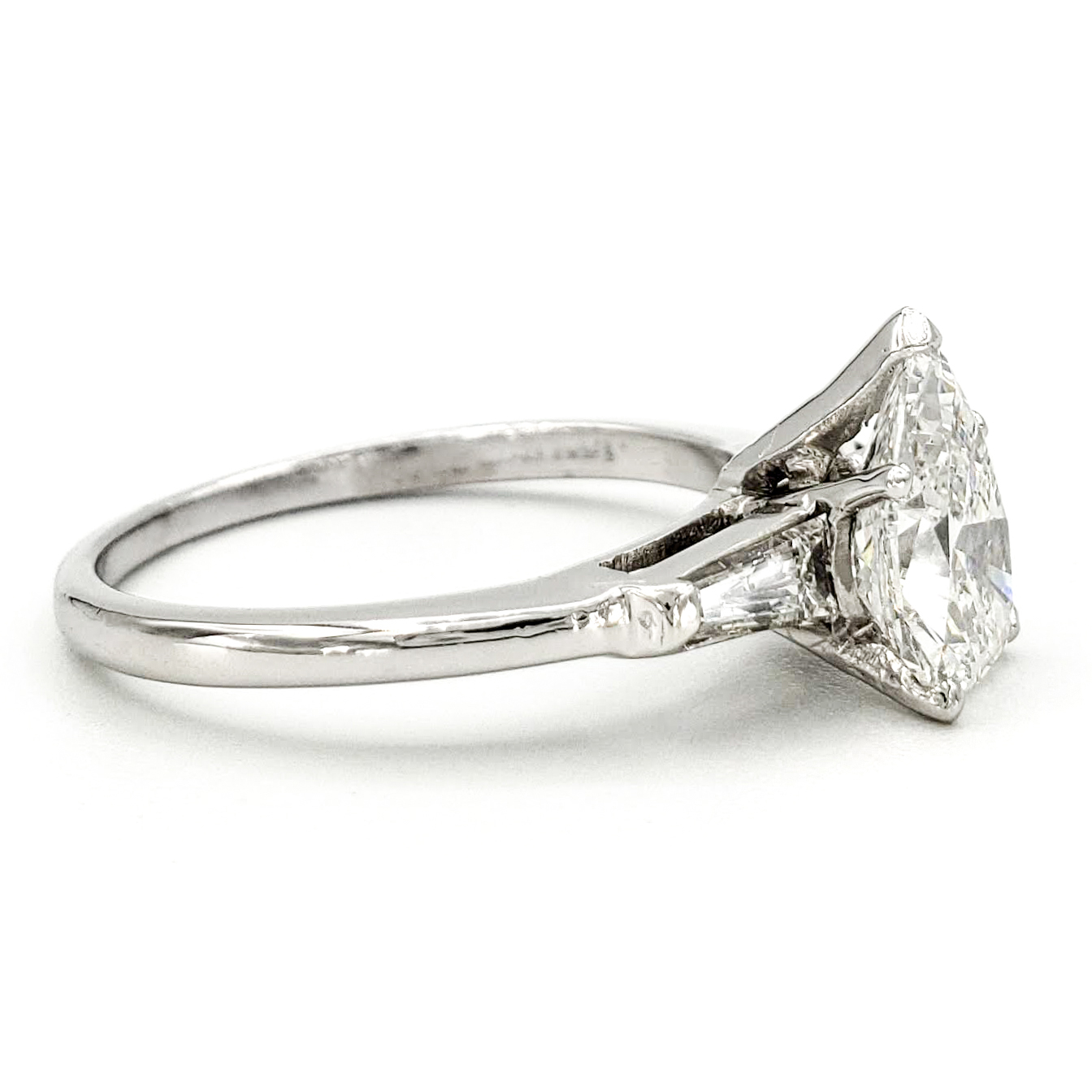 vintage-platinum-engagement-ring-with-1-16-carat-pear-brilliant-cut-diamond-egl-f-vs2